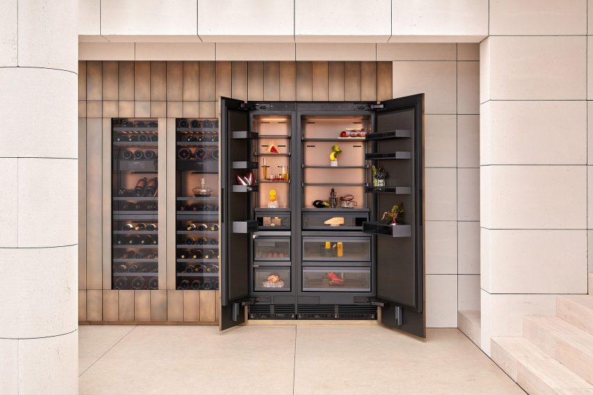 Open refrigeration units displaying food and wine alongside integrated wine storage