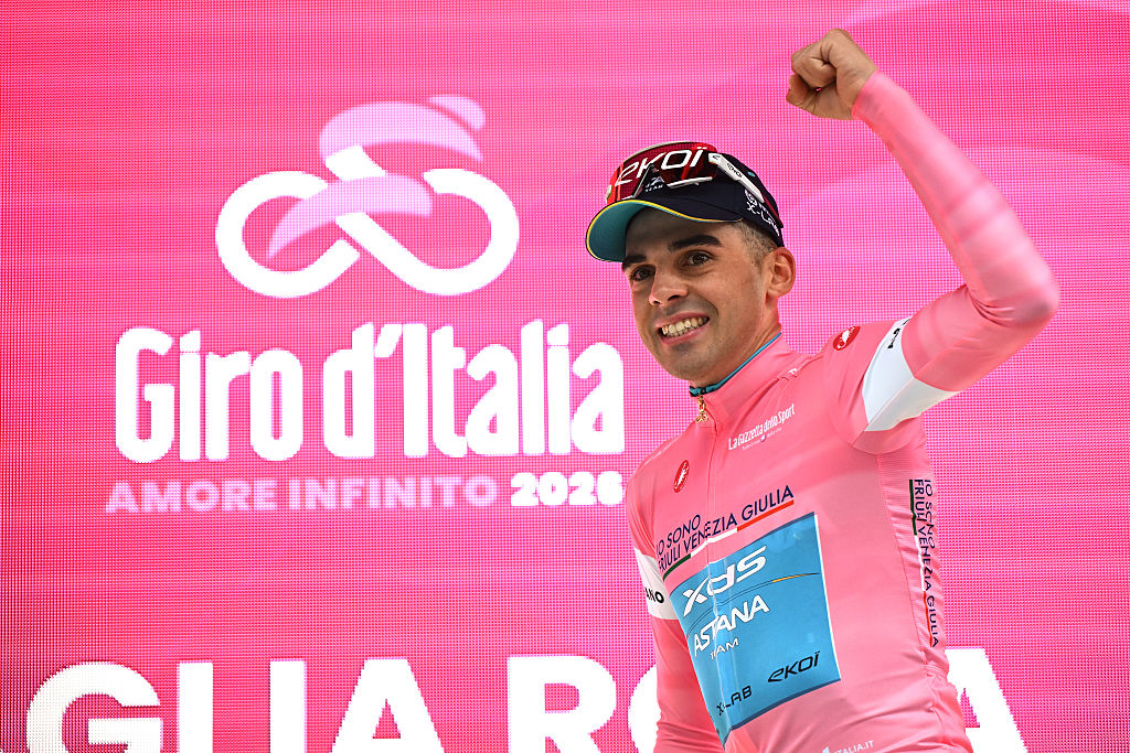 Guillermo Thomas Silva of Uruguay and Team XDS Astana celebrates at podium as Pink Leader Jersey winner during the 109th Giro d'Italia