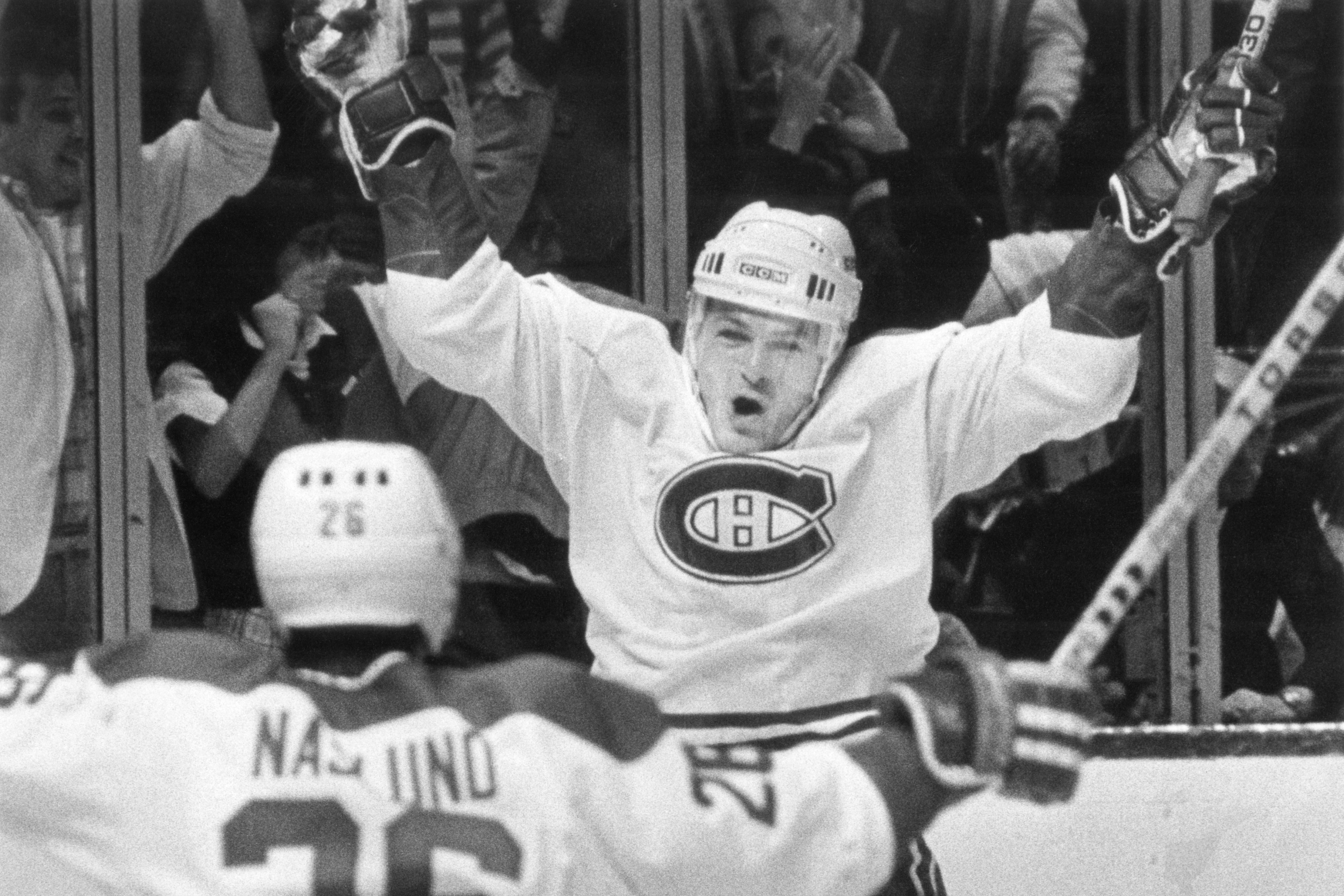 Claude Lemieux, right, celebrates a goal with teammate Mats Naslund against the New York Rangers in the Stanley Cup playoff semifinals in May 1986. 