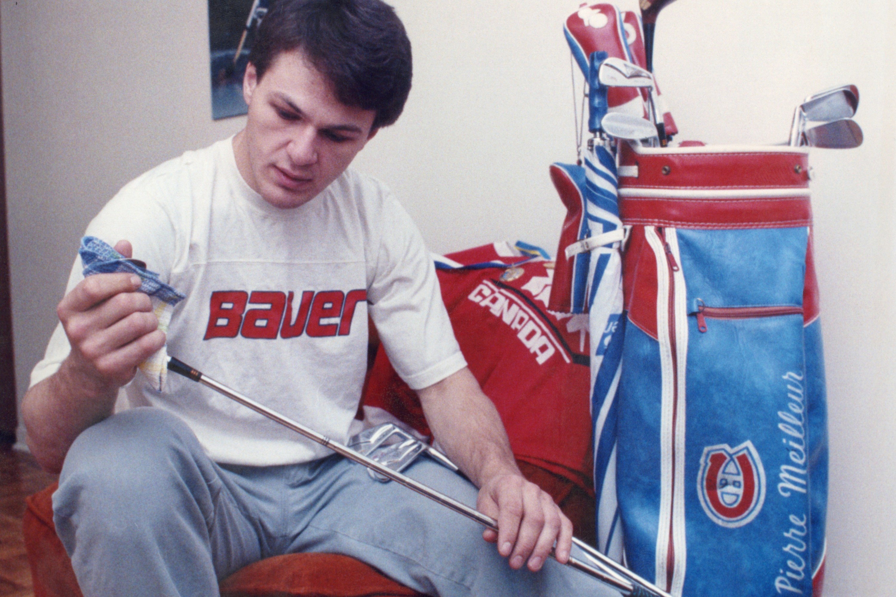 Claude Lemieux with a different kind of sticks — golf clubs in 1985.