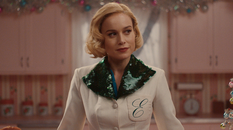 Brie Larson as Elizabeth Zott in a kitchen decorated for Christmas in Lessons in Chemistry