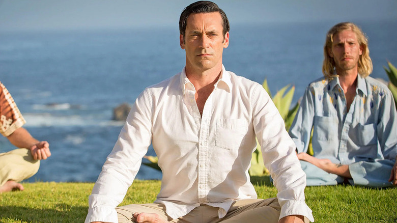 Don Draper sits meditating on a cliff overlooking the ocean