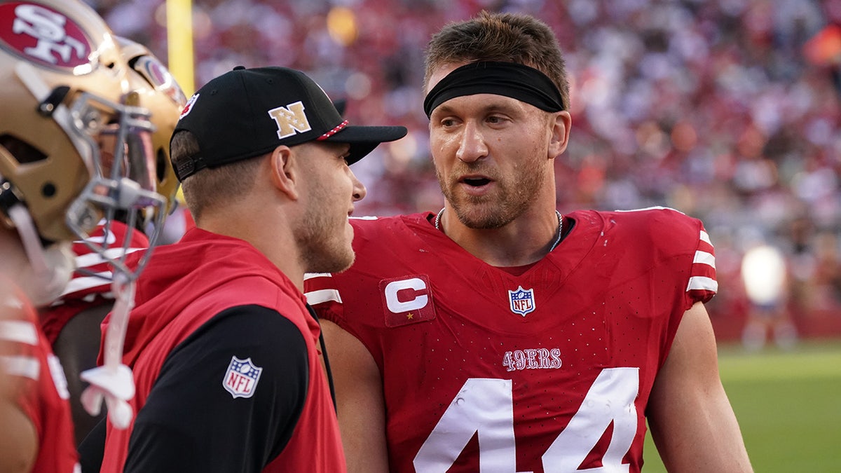 San Francisco 49ers fullback Kyle Juszczyk talks with running back Christian McCaffrey on the sideline at Levi's Stadium