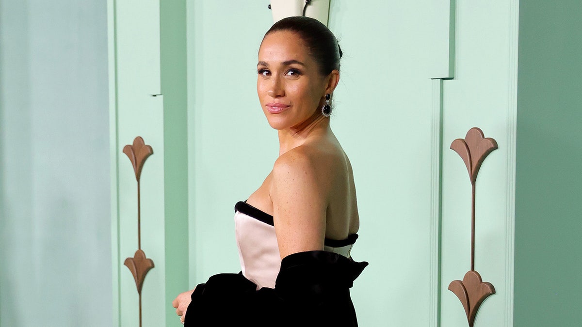 Meghan Duchess of Sussex wearing strapless dress at fundraising gala
