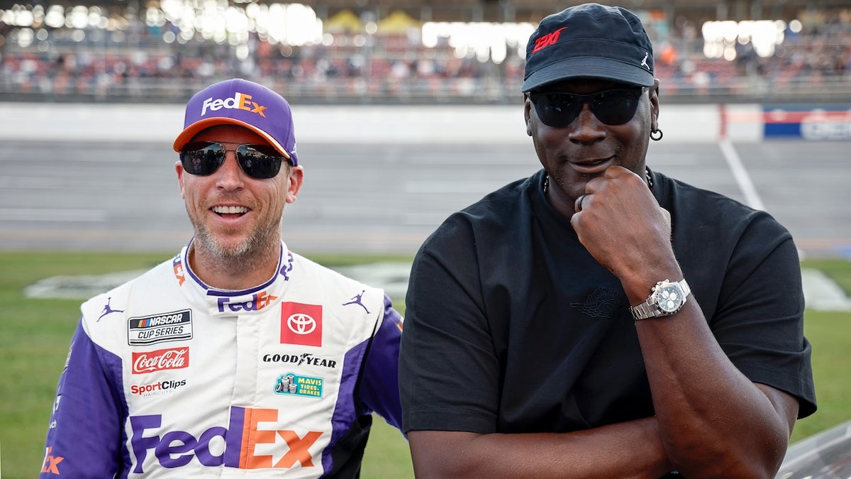 Denny Hamlin and Michael Jordan talking on the grid at Talladega Superspeedway