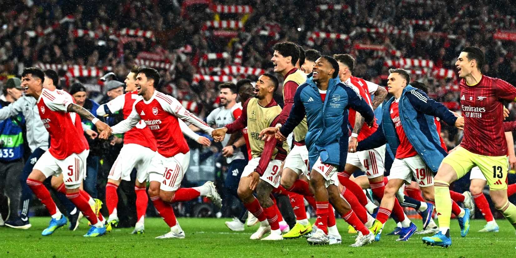 Arsenal's Kepa Arrizabalaga and Myles Lewis-Skelly celebrate with teammates after reaching the UEFA Champions League final