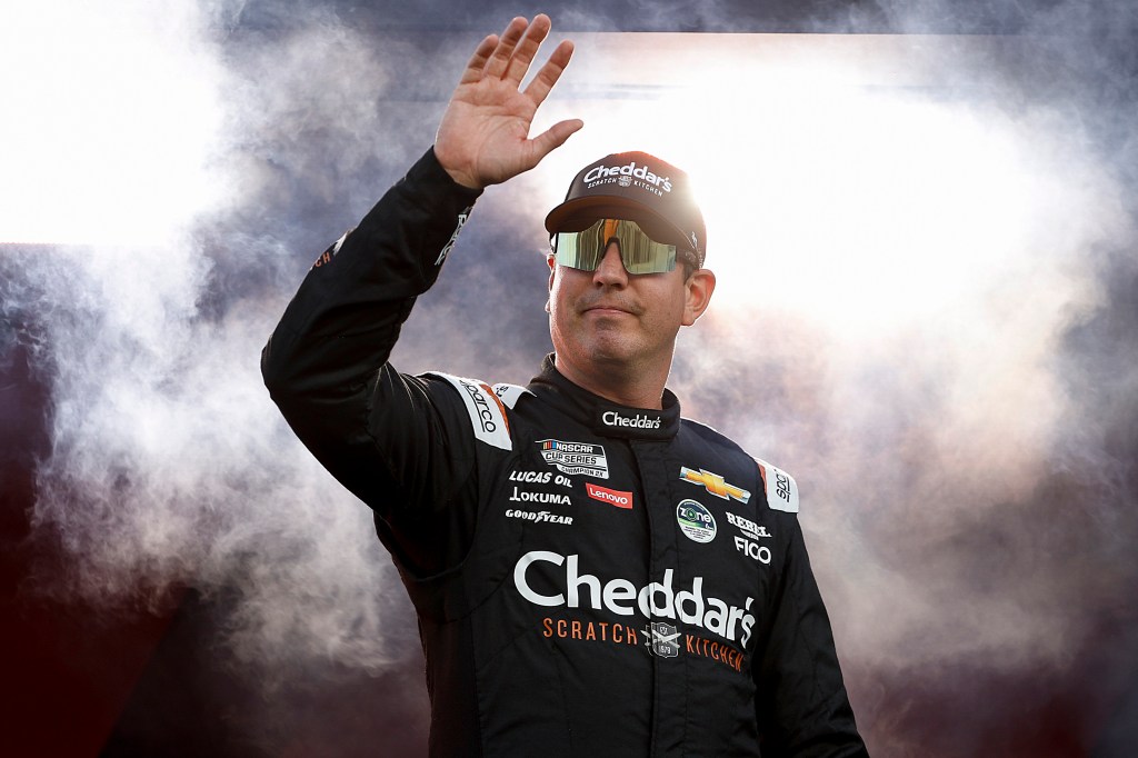 Kyle Busch, driver of the #8 Cheddar's Scratch Kitchen Chevrolet, waves to fans during intros at the NASCAR Cup Series Coke Zero Sugar 400.