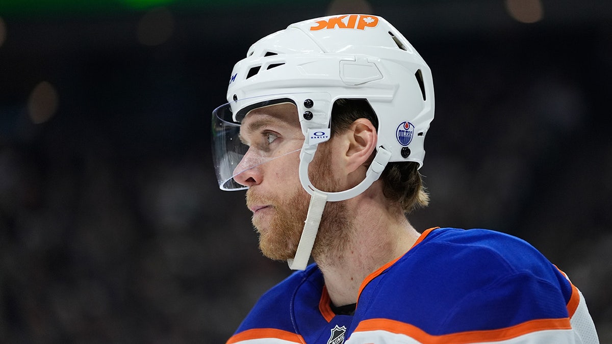 Edmonton Oilers center Connor McDavid standing on ice during NHL game