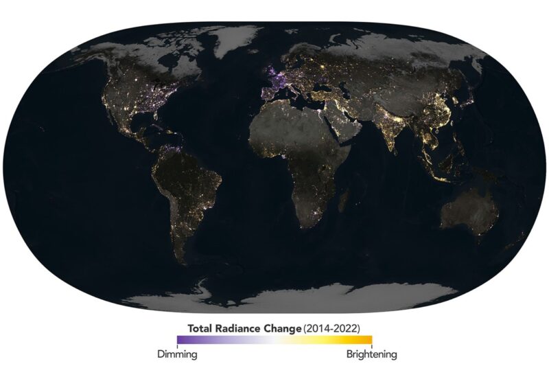 Map of globe with night lights in yellow, white and purple.