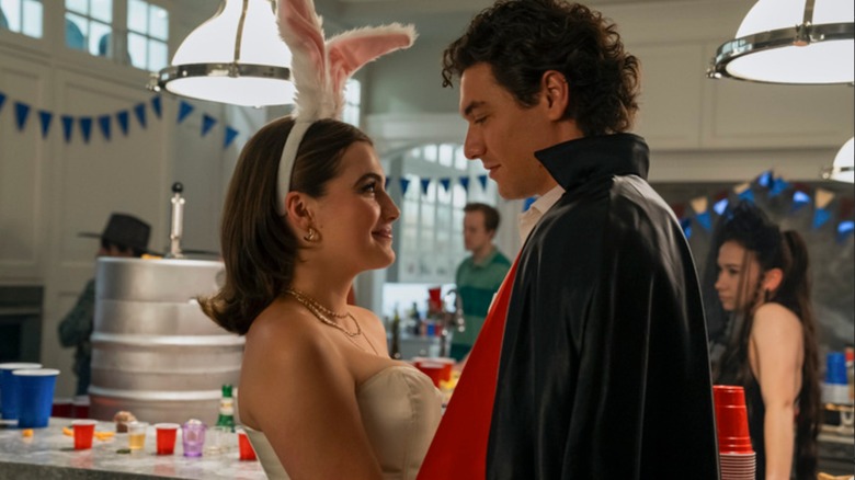 Hannah Wells and Garrett Graham in Halloween costumes, smiling at each other