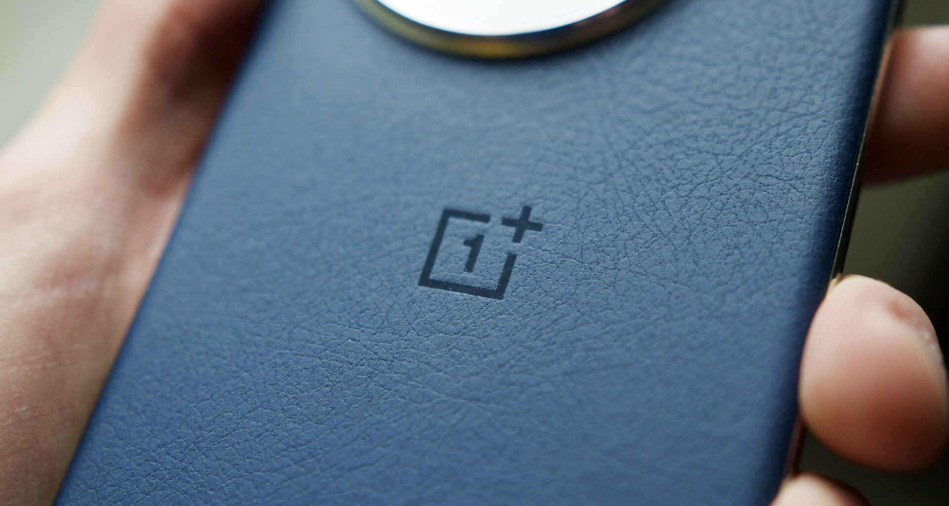 Close-up of the OnePlus logo on the OnePlus 13.