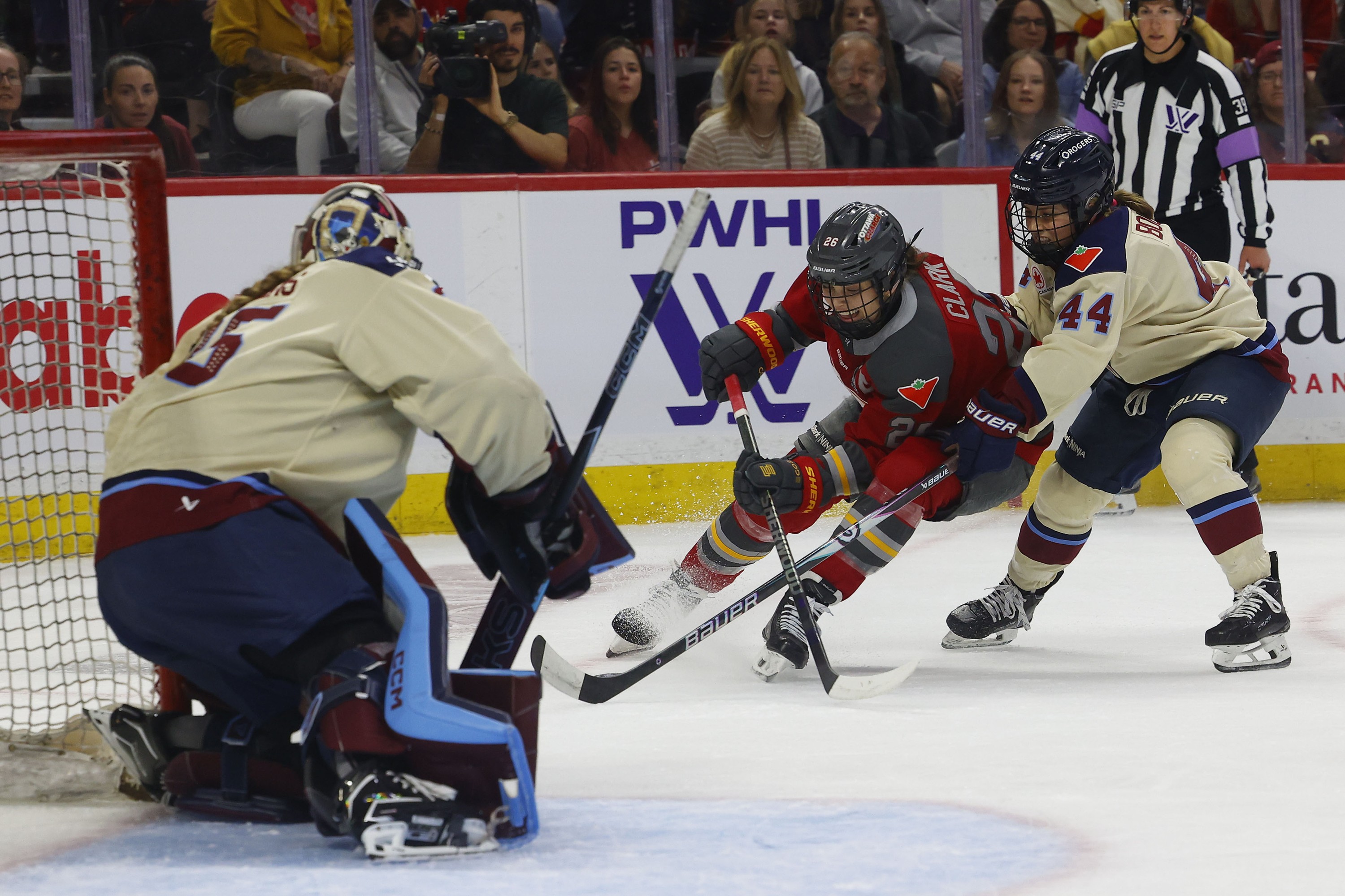 Ottawa Charge Emily Clark tries to rush past Victoire's Amanda Boulier