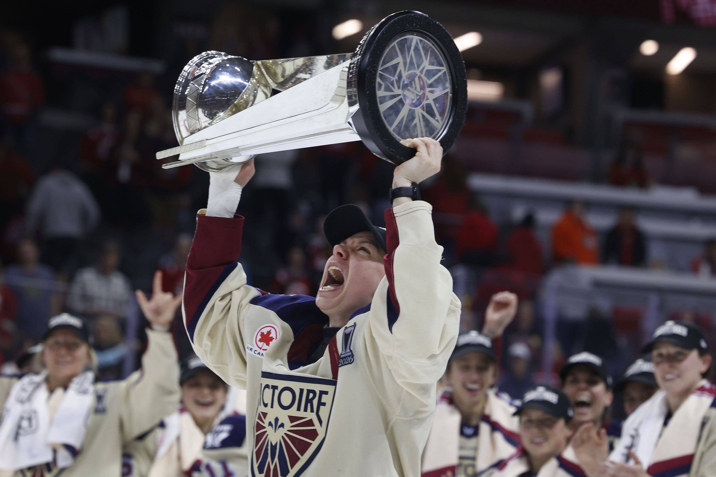 Montreal Victoire's Erin Ambrose hoists the Walter Cup.