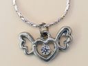 A necklace worn by a homicide victim who died inside a garage in the Cabbagetown area of Toronto on Saturday, May 23, 2026.