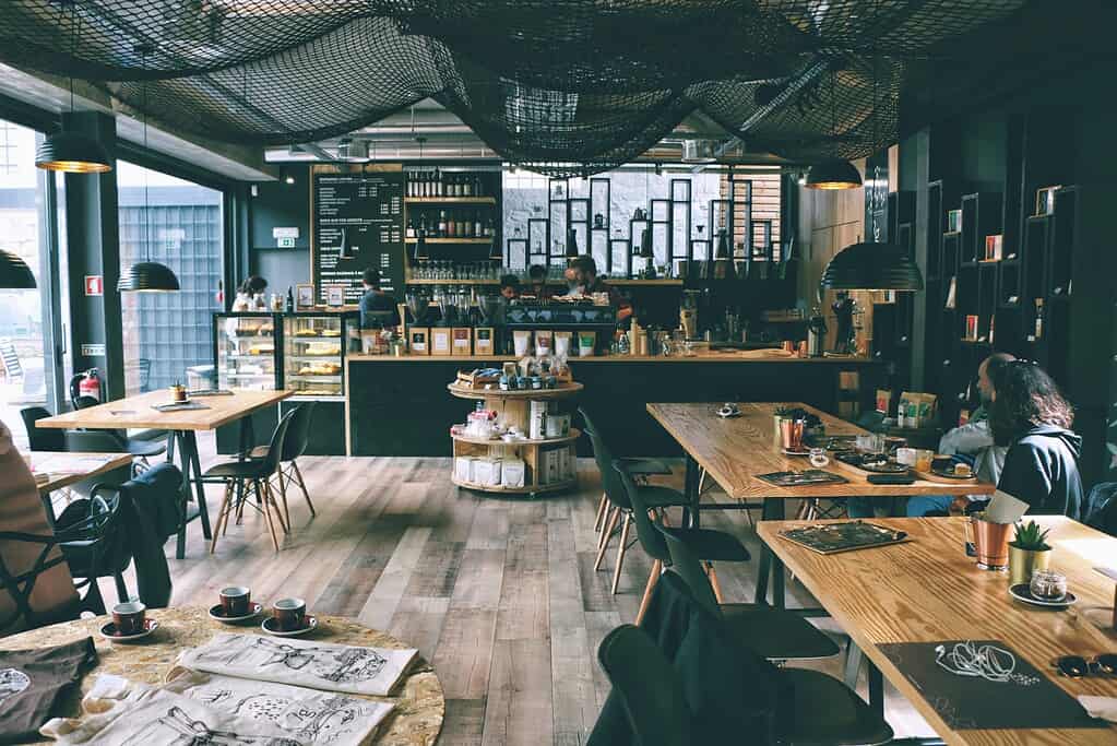A cosy coffee shop with mostly empty tables