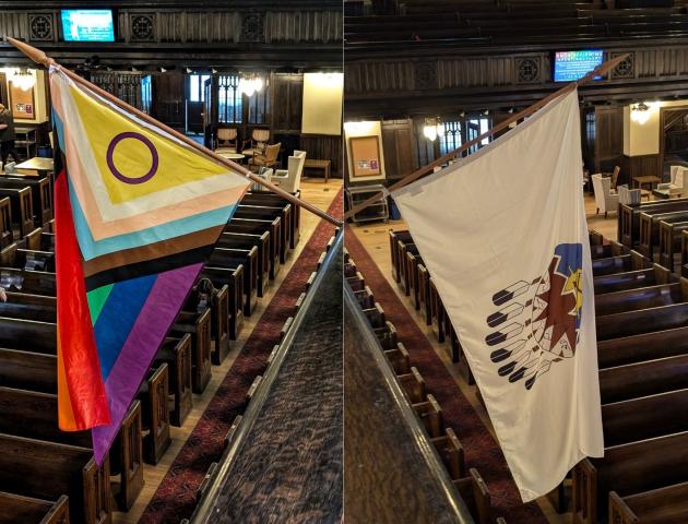 Two flags hang inside a church