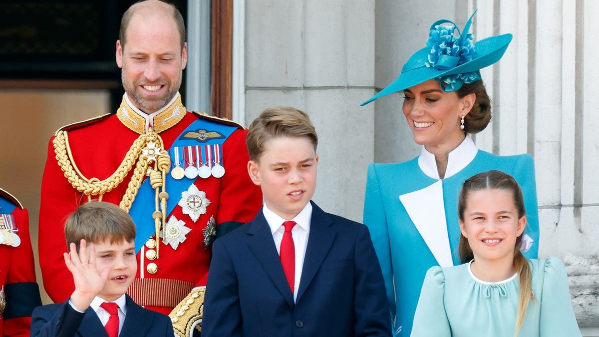 Prince William, Prince Louis, Prince George, Catherine, and Princess Charlotte watching RAF flypast at Buckingham Palace