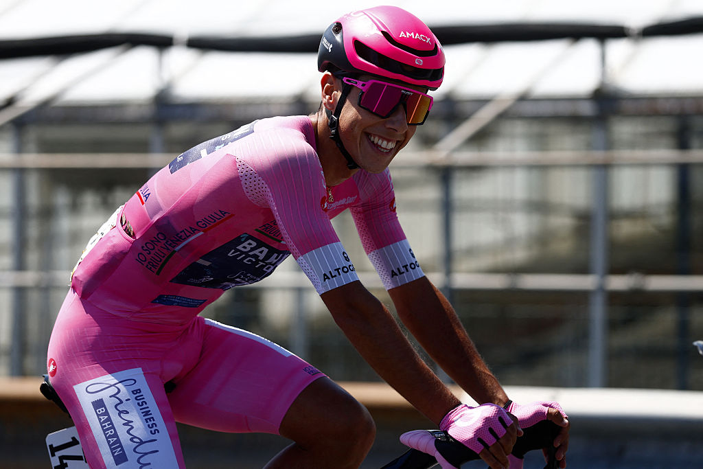 Pink jersey Bahrain - Victorious Portuguese rider Afonso Eulalio rides in the peloton during the 12th stage of the Giro d'Italia 2026 - Tour of Italy cycling race between Imperia and Novi Ligure, Italy, on May 21, 2026. (Photo by Luca Bettini / AFP)