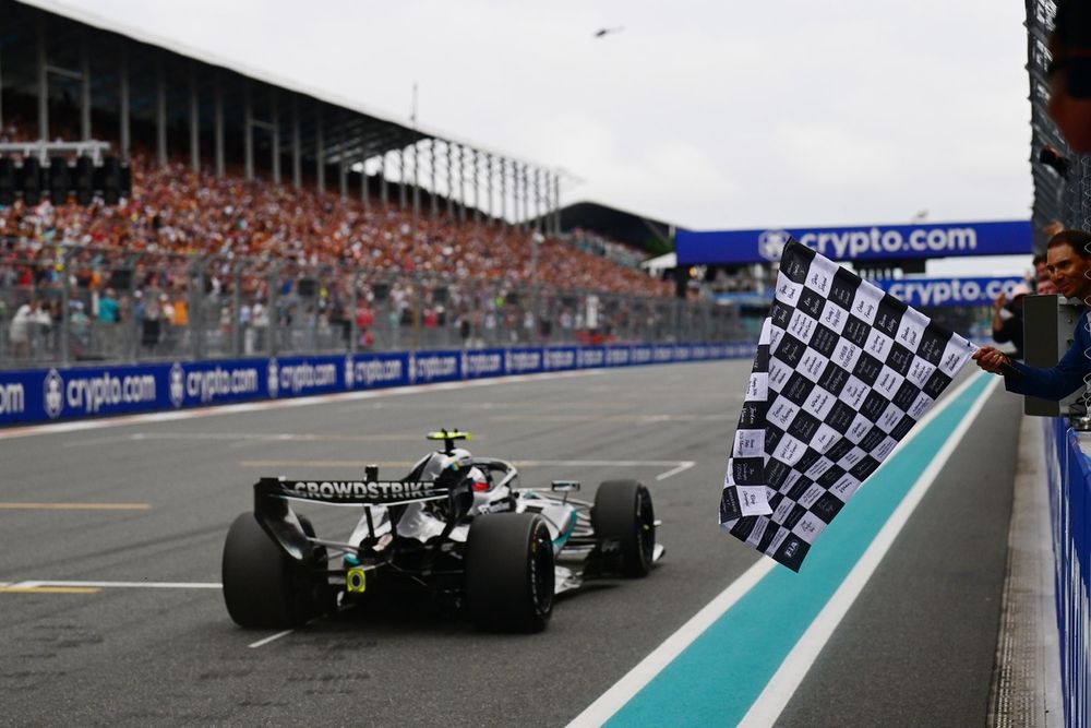 Rafael Nadal waves the chequered flag for Race winner Andrea Kimi Antonelli, Mercedes