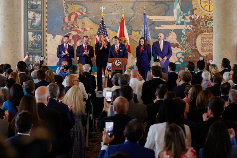 Acting U.S. Attorney General, Todd Blanche speaks, while with U.S. Attorney for the Southern District of Florida, Jason A. Reding Quinones, President of Miami Dade College Madeline Pumariega, Co-Deputy Director of the FBI, Christopher Gilbert Raia, U.S. Senator Ashley Moody (R-FL) and Florida Attorney General James Uthmeier, as the U.S. Department of Justice announces criminal charges against former Cuban President Raul Castro, during a ceremony to honor the victims of the 1996 shootdown of Brothers to the Rescue aircraft incident, at Freedom Tower in Miami, Florida, U.S., May 20, 2026. REUTERS/Marco Bello