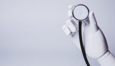 A robot hand holding a stethoscope.