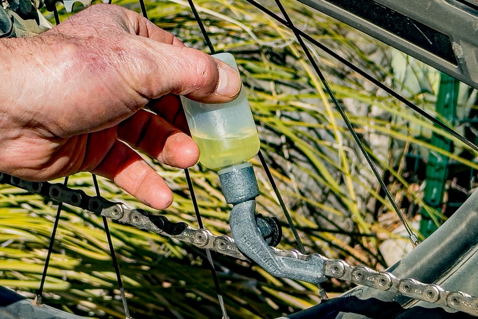 a tool lubricating a bicycle chain
