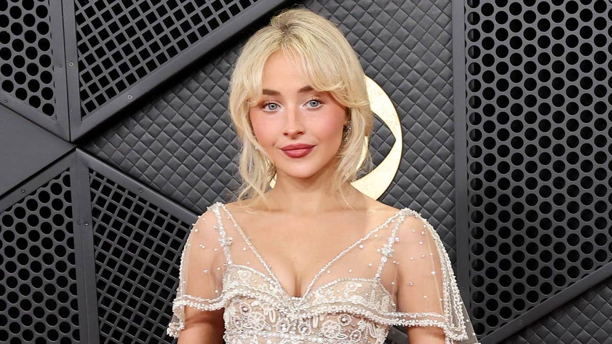 Sabrina Carpenter wearing a white dress at the Grammy Awards in Los Angeles
