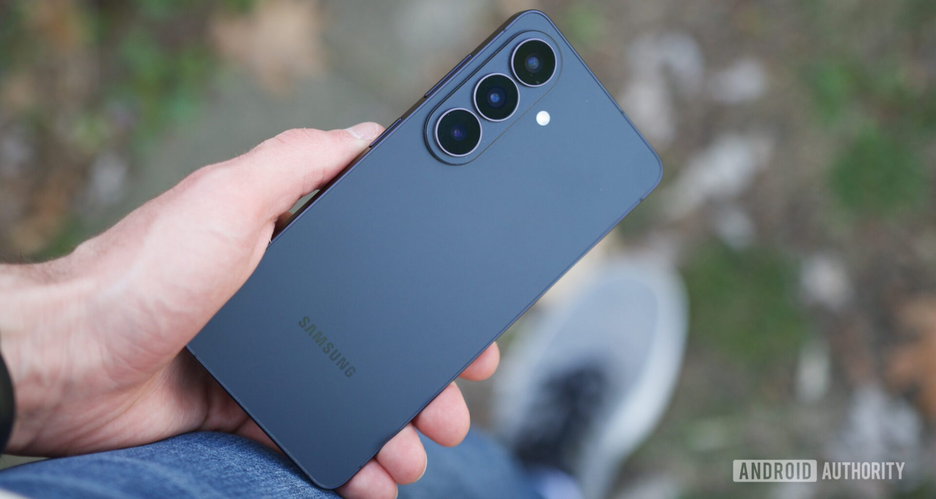 Someone holding the Galaxy S26, showing the back of the phone.