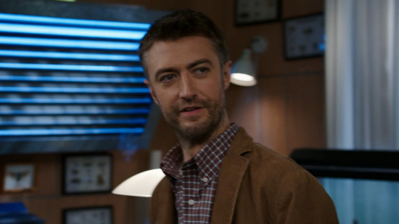 Sean Gunn as Dr. Howard Fitch smiles in Bones