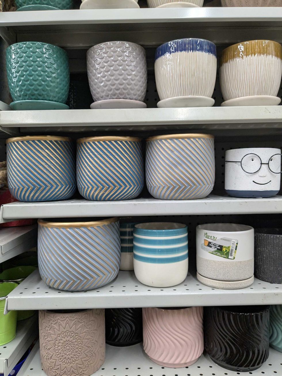 Shelves full of various plant pots