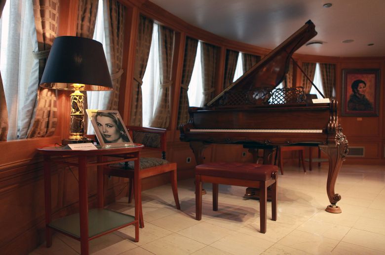 A portrait of Grace Kelly in the piano room of the Christina O.