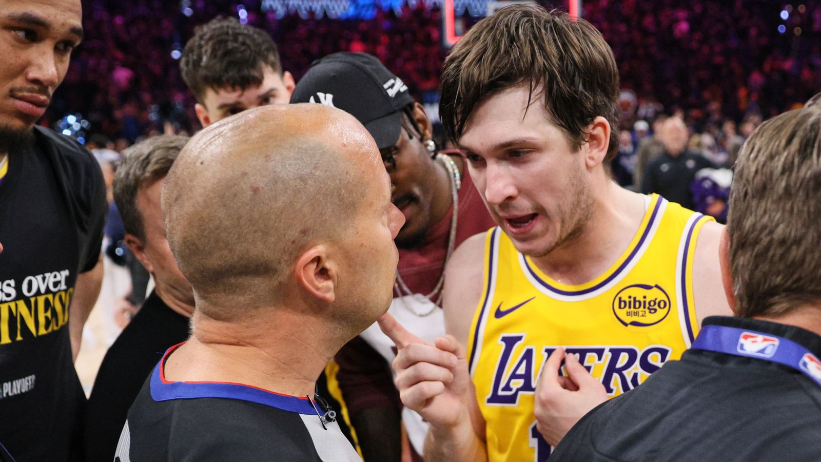 Los Angeles Lakers' Austin Reaves, center right, talks with referee John Goble, center, left, after the team's loss in Game 2 in a second-round NBA basketball playoffs series against the Oklahoma City Thunder Thursday, May 7, 2026, in Oklahoma City. (AP Photo/Nate Billings)