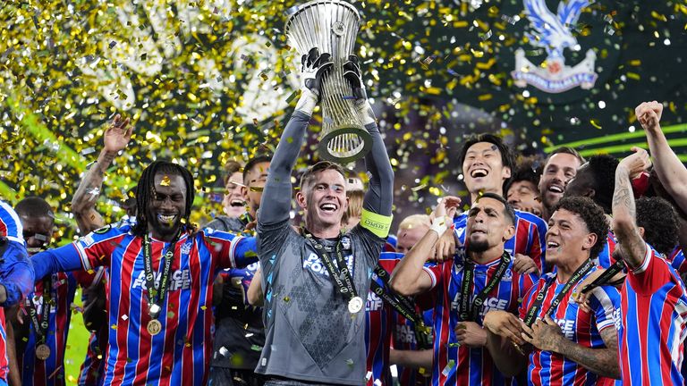 Crystal Palace goalkeeper Dean Henderson lifts the UEFA Europa Conference League trophy