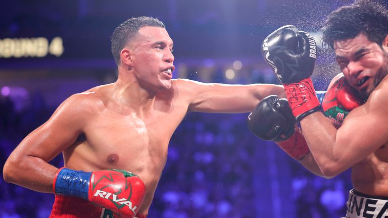 David Benavidez punches Gilberto Ramirez in a cruiserweight championship boxing match Saturday, May 2, 2026, in Las Vegas. (AP Photo/Ian Mau