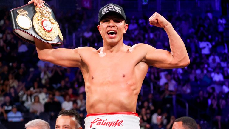 Jaime Munguia celebrates after defeating Armando Resendiz, not pictured, in a super middleweight championship boxing match Saturday, May 2, 2026, in Las Vegas. (AP Photo/Ian Maule)
