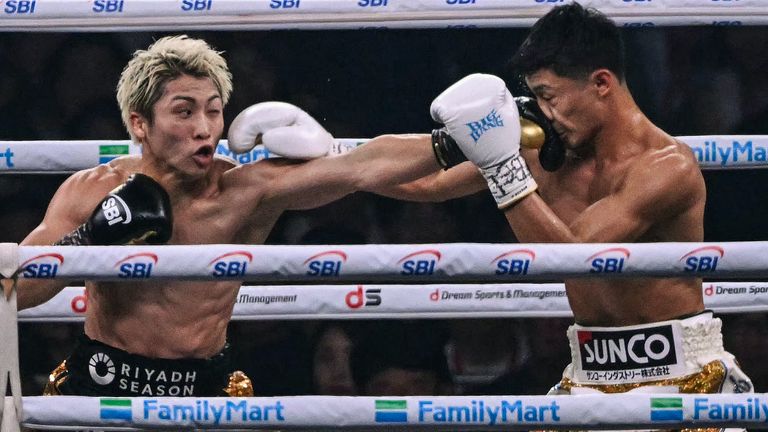 Naoya Inoue (L) fights Junto Nakatani during their super bantamweight championship boxing contest at Tokyo Dome in Tokyo on May 2, 2026. (Photo by Yuichi YAMAZAKI / AFP)