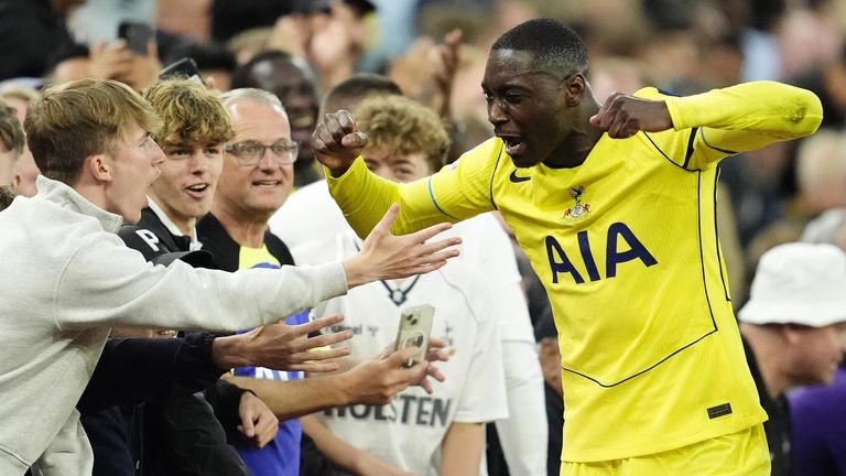 Randal Kolo Muani gees up the Spurs supporters after being substituted at Villa Park