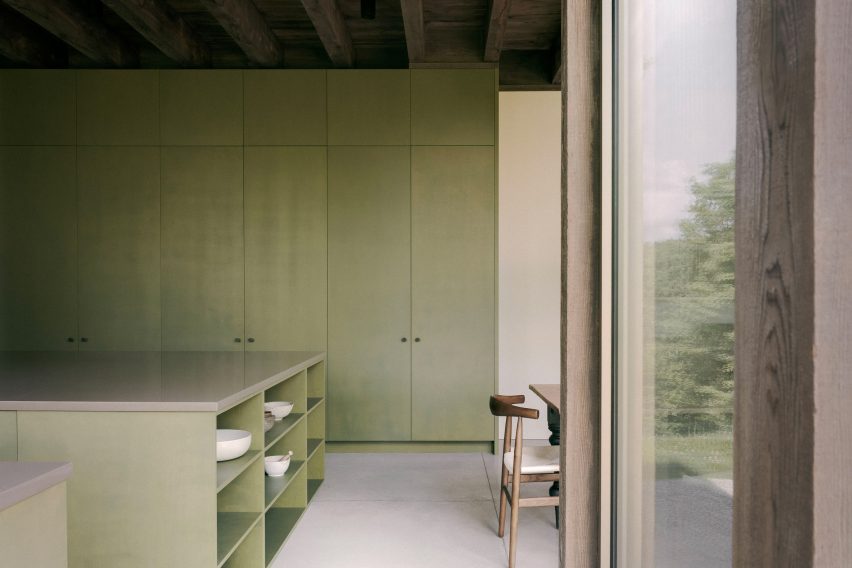 Kitchen with green cabinets in a home in Quebec