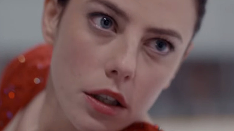 A close-up of Kaya Scodelario as Kat while skating in Spinning Out