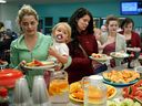 Teen mothers enjoy a meal at Braemar School during an early Mother’s Day pancake breakfast in 2018. Cam Tait would like to see a way to honour Edmonton’s single moms with brunch on Mother’s Day.