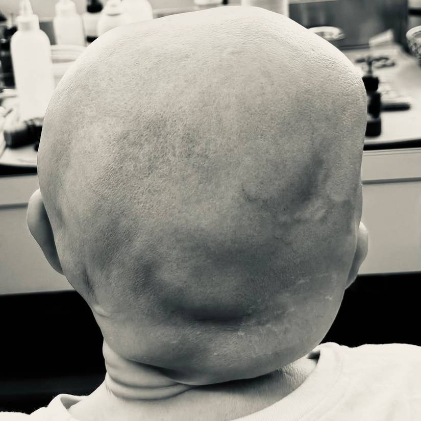 The back of Jason Voorhees' head in the makeup chair behind the scenes on Crystal Lake