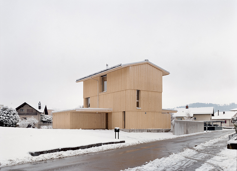 a compact timber tower house rises from a triangular site in switzerland - 1