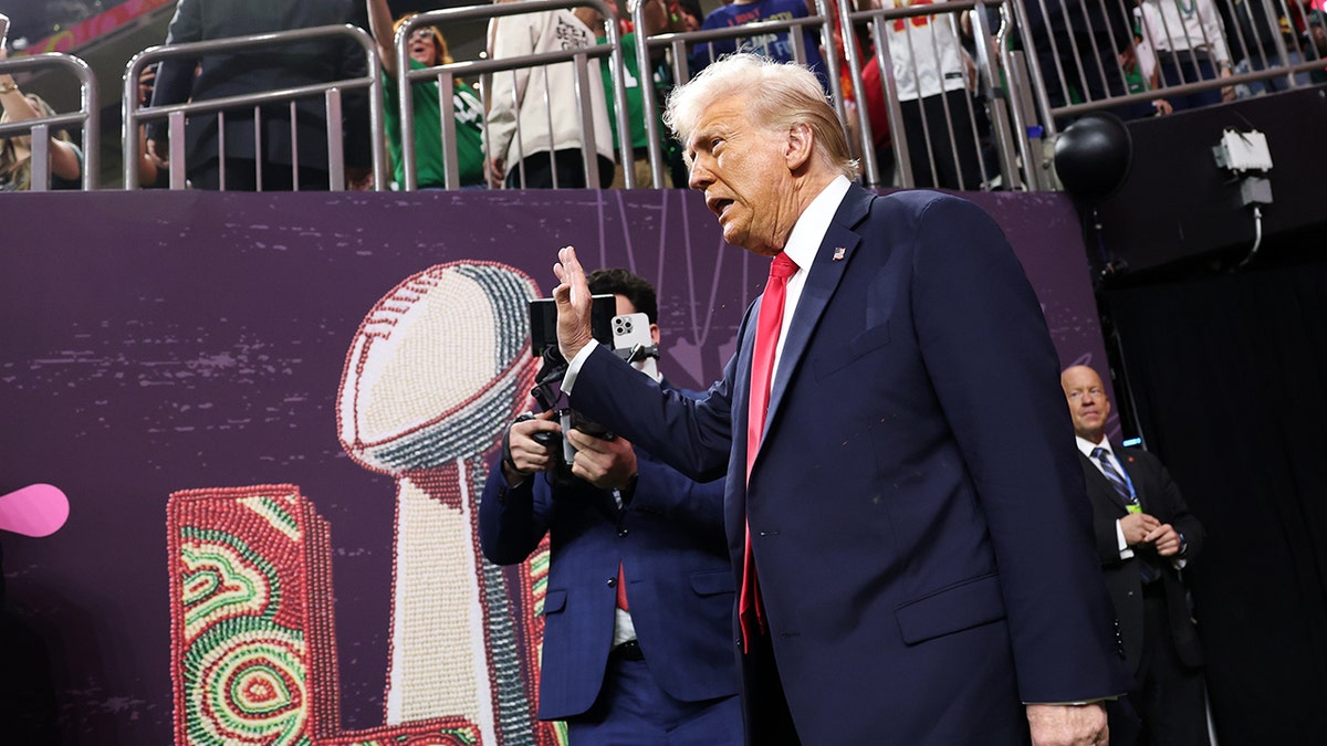 U.S. President Donald Trump walking onto the field at Caesars Superdome