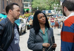 This image released by CBS shows Donnie Wahlberg, left, and Sonequa Martin-Green in a scene from Boston Blue.'