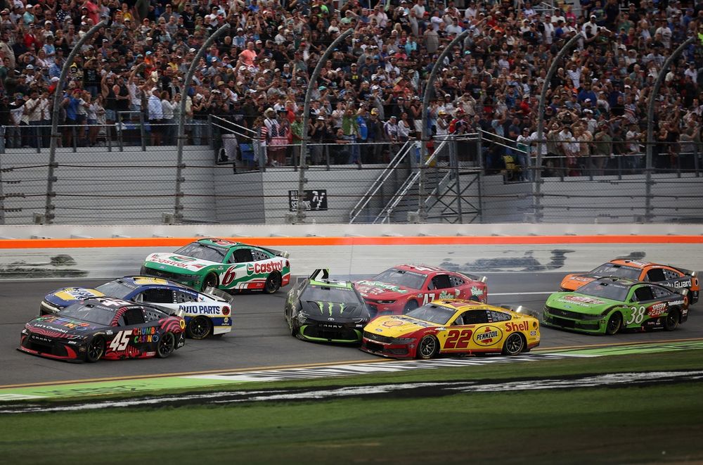 Reddick (#45) wins the Daytona 500 as rivals crash behind him
