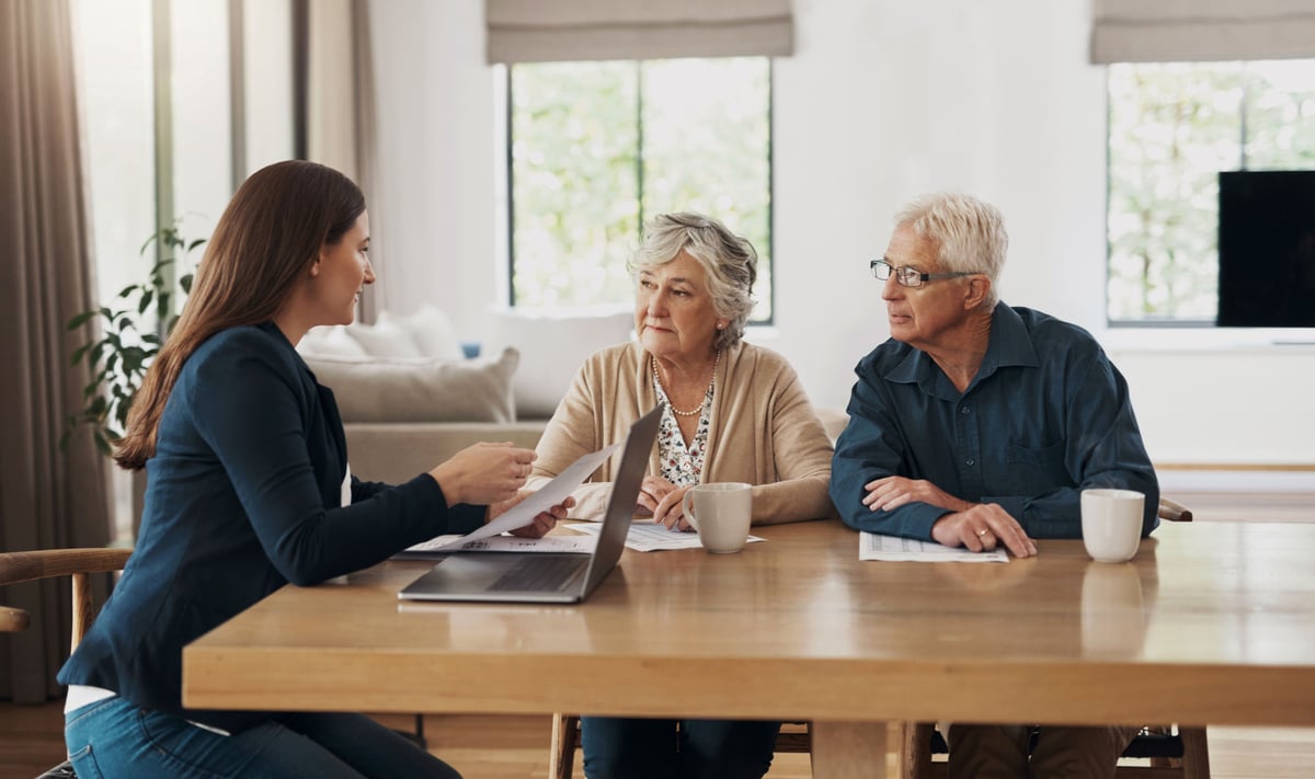 Retirees are speaking with a financial advisor.