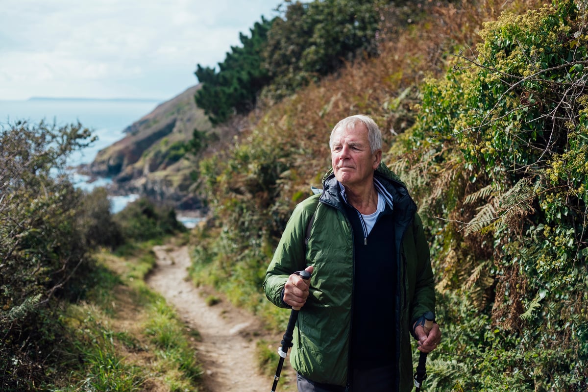 Person hiking near the ocean.
