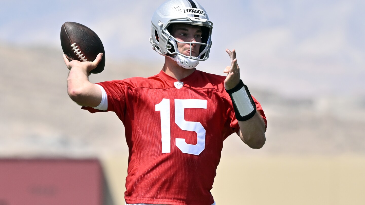 Fernando Mendoza learning to play from under center for the first time in the NFL
