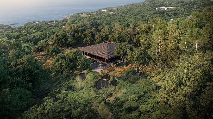V taller proposes forest retreat around monolithic stone core for NOT A HOTEL in japan - 2