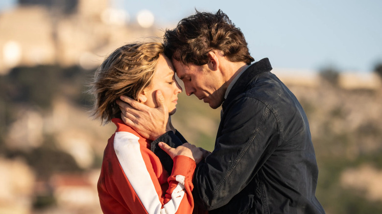 Alice and Tom embrace in 
